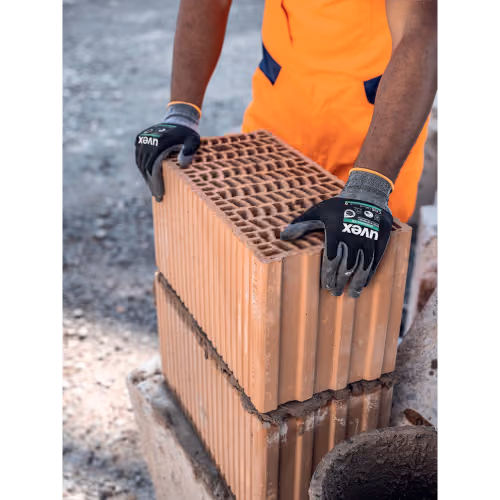 Uvex phynomic XG werkhandschoenen met bouwmaterialen